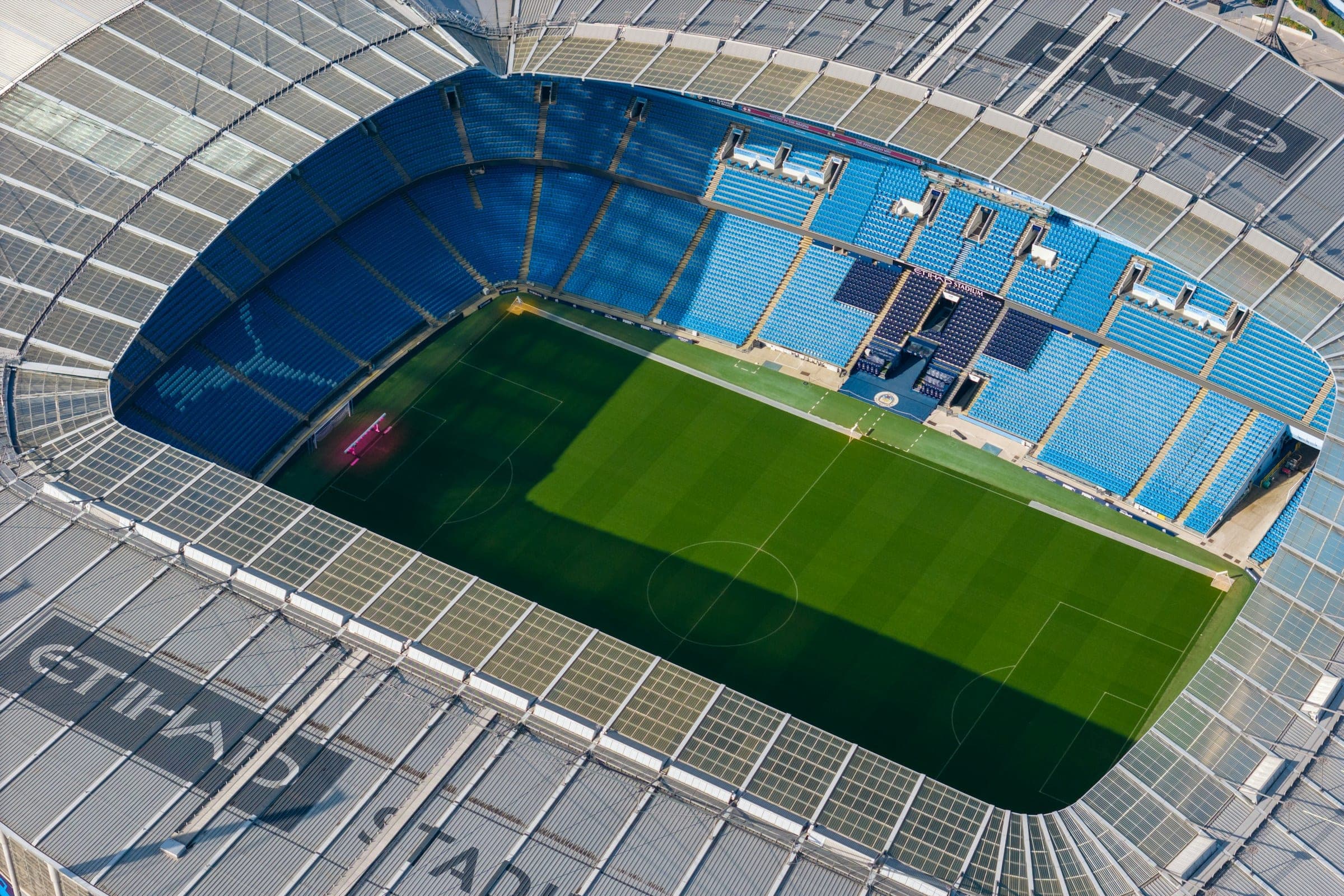 The Etihad Stadium in Manchester from above, with its name painted across the roof